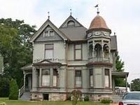 a big Victorian house on the country side