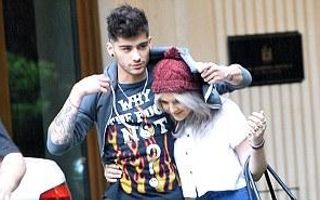 Perrie Edwards covers Zayn Malik's rude T-shirt as she shelters under his hoodie during romantic stroll | Mail Online