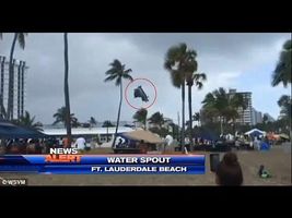 [RAW] Dramatic moment water spout drags bouncy castle into the air