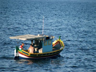 Which boat is typically used for fishing in shallow waters?