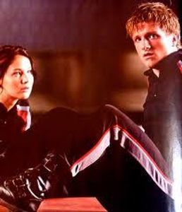 When did Katniss relize that she loved peeta