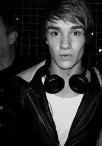 Liam plucks his eyebrows.