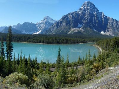 Which famous trail takes riders through the breathtaking Canadian Rockies?