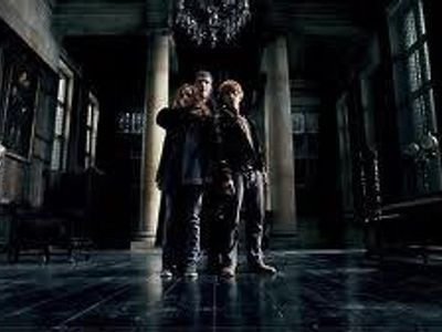 When held hostage at Malfoy Manor what is the name of the death eater who is torturing Hermione as she believes Hermione has broken into her vault at Gringotts?