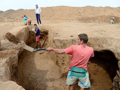 What is the main focus of archaeological excavation?