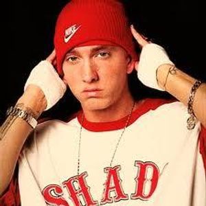 When did Eminem quite school (which grade)? and why?