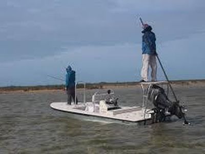 Which type of fishing boat is specifically designed for fly fishing?