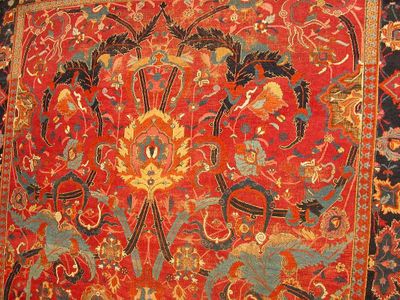 What does the term 'arabesque' refer to in Islamic art?