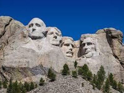 Who created the monumental sculpture 'Mount Rushmore'?