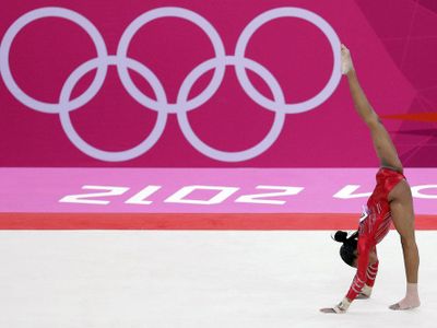 Who is the only gymnast to be awarded a perfect score of 10 in the Olympics?