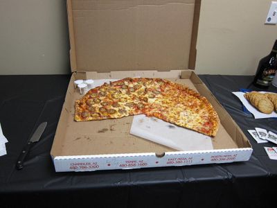 Which ingredient was not used in the largest pizza?