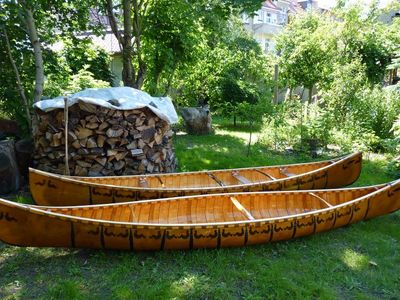 Which material is commonly used to construct canoes?