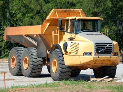 Which type of truck is designed to carry heavy loads and is commonly used in construction sites?