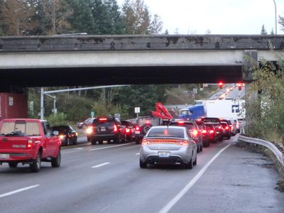 When do you have to turn your headlights on while driving on the highway?