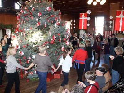 Tree Dance: After dinner, people join hands around the Christmas tree, and dance around it while singing traditional Danish Christmas songs. Is this done before or after the presents are unwrapped?