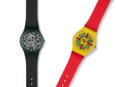 Which type of watch was the Swatch created to compete with?