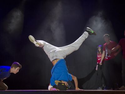 Which of the following elements is NOT part of the hip-hop culture that breakdancing emerged from?