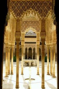 Which city is known for its magnificent Islamic architecture in the form of the Alhambra?