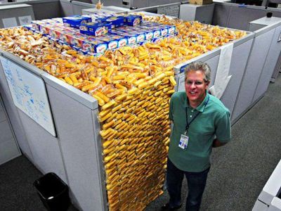 Which prank involves filling someone's office cubicle with balloons?