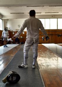 The correct grip for a fencing weapon is: