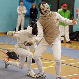 What is the traditional salute performed by fencers before a match called?