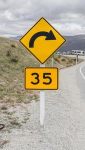 What is the advisable speed when entering a curve or bend?