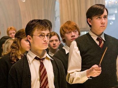 How much older is Neville Longbottom than Harry Potter?