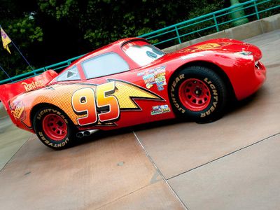 Which Pixar film is about a race car named Lightning McQueen?