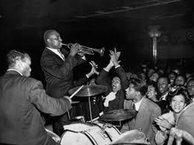 What famous jazz club was located in Harlem during the Harlem Renaissance?