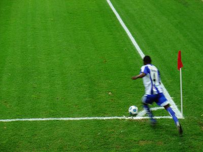 When does a corner kick occur in football?