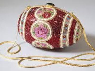 Which designer is known for their eccentric handbag designs?