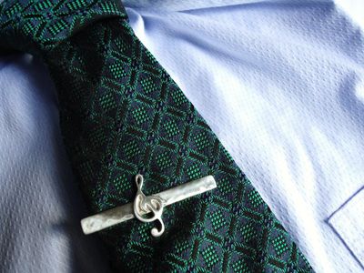 What is the purpose of a tie clip?