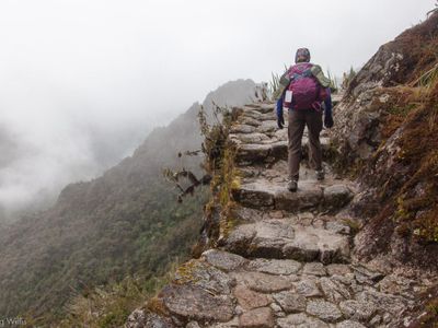 Which mountain range includes the popular hiking trail called the 'Inca Trail'?