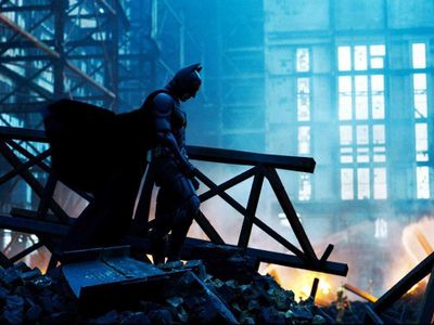 Who directed the explosive movie 'The Dark Knight' starring Christian Bale as Batman?