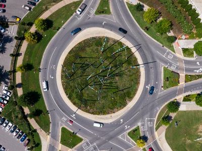 Which of the following should you do in a roundabout?