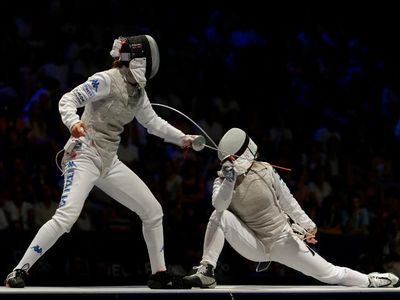 Which piece of protective gear is mandatory for modern fencing?