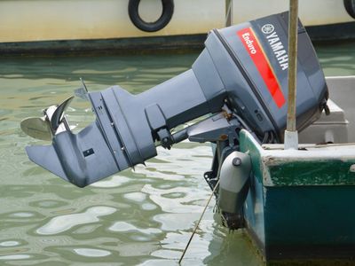 What is the purpose of an outboard motor on a boat?