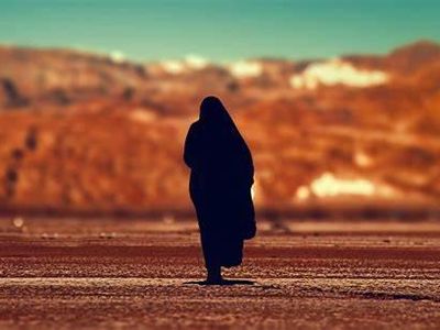 Which woman is revered as one of the greatest scholars of her time in Islamic history?