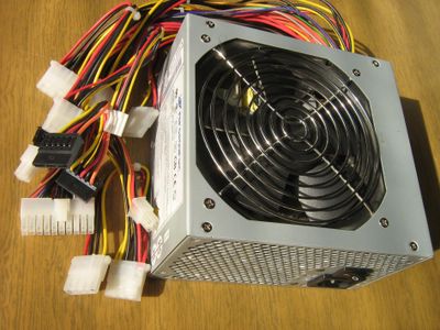 What is the purpose of a power supply unit (PSU) in a computer?