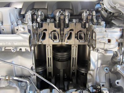 What is the purpose of a fuel injector in a truck engine?