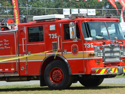 Which type of truck is specially designed for extinguishing fires and carrying firefighting equipment?