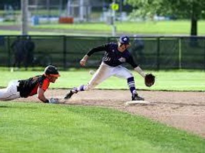 During fielding practice, what position is emphasized for proper ground ball technique?