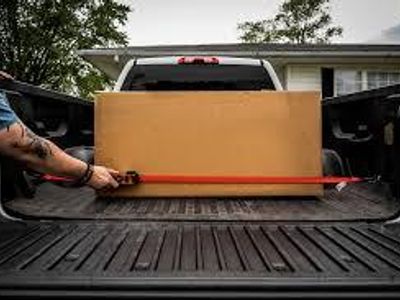 How can you secure items in a truck bed?