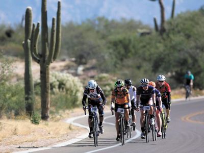 What is the correct order for hand signals used while cycling on the road?