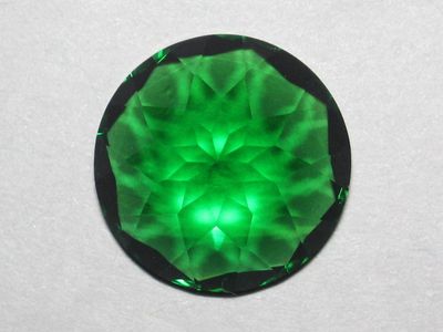 Which gemstone is known for its deep green color?