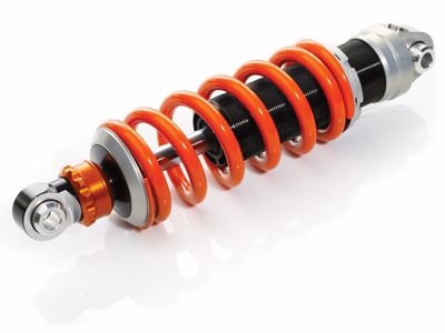 What is the purpose of shock absorbers in a truck lifting kit?