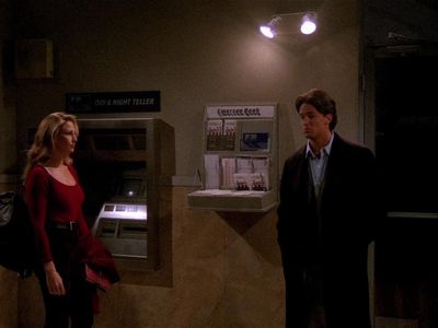 During the blackout, who was Chandler locked in with at the ATM Vestibule?