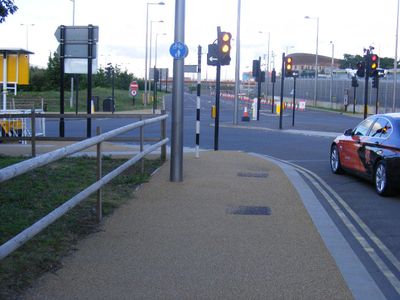 What is the best way to safely overtake a cyclist on the road?