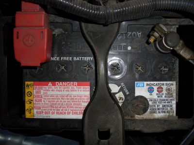 When checking the battery, one should look for: