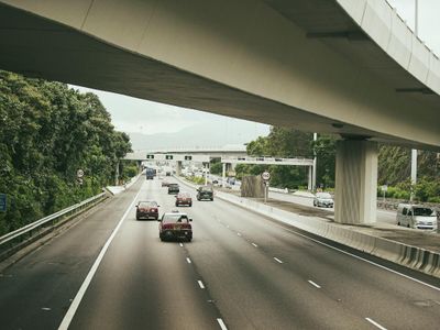 When overtaking another vehicle, which direction should you take your vehicle?